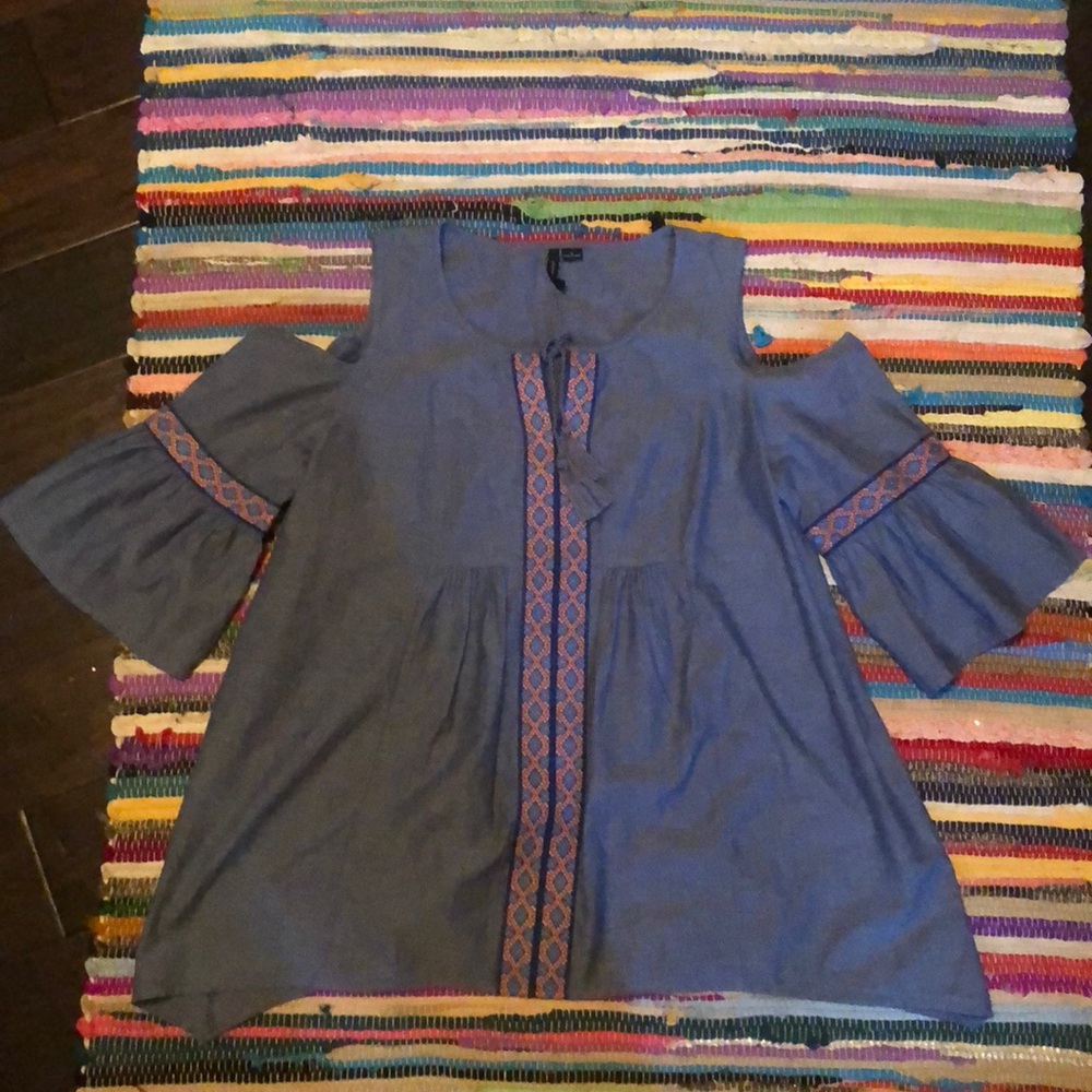 A new directions cut out shoulder long sleeve top.